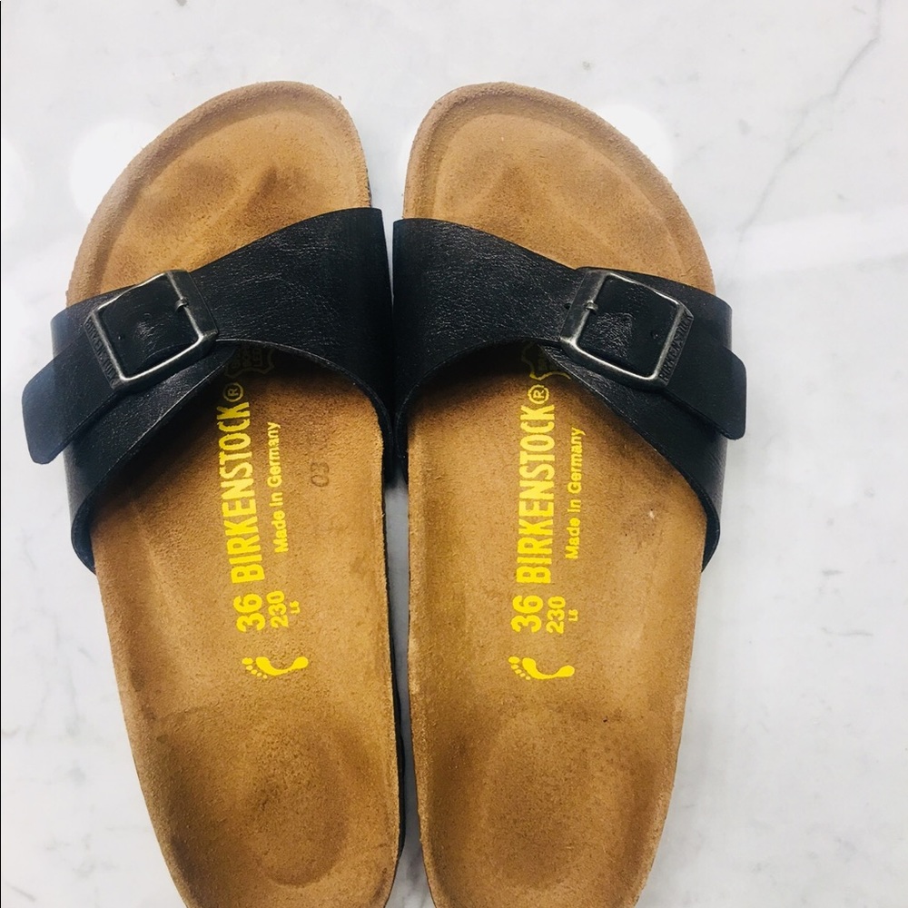 Women’s black Birkenstock single strap sandal.